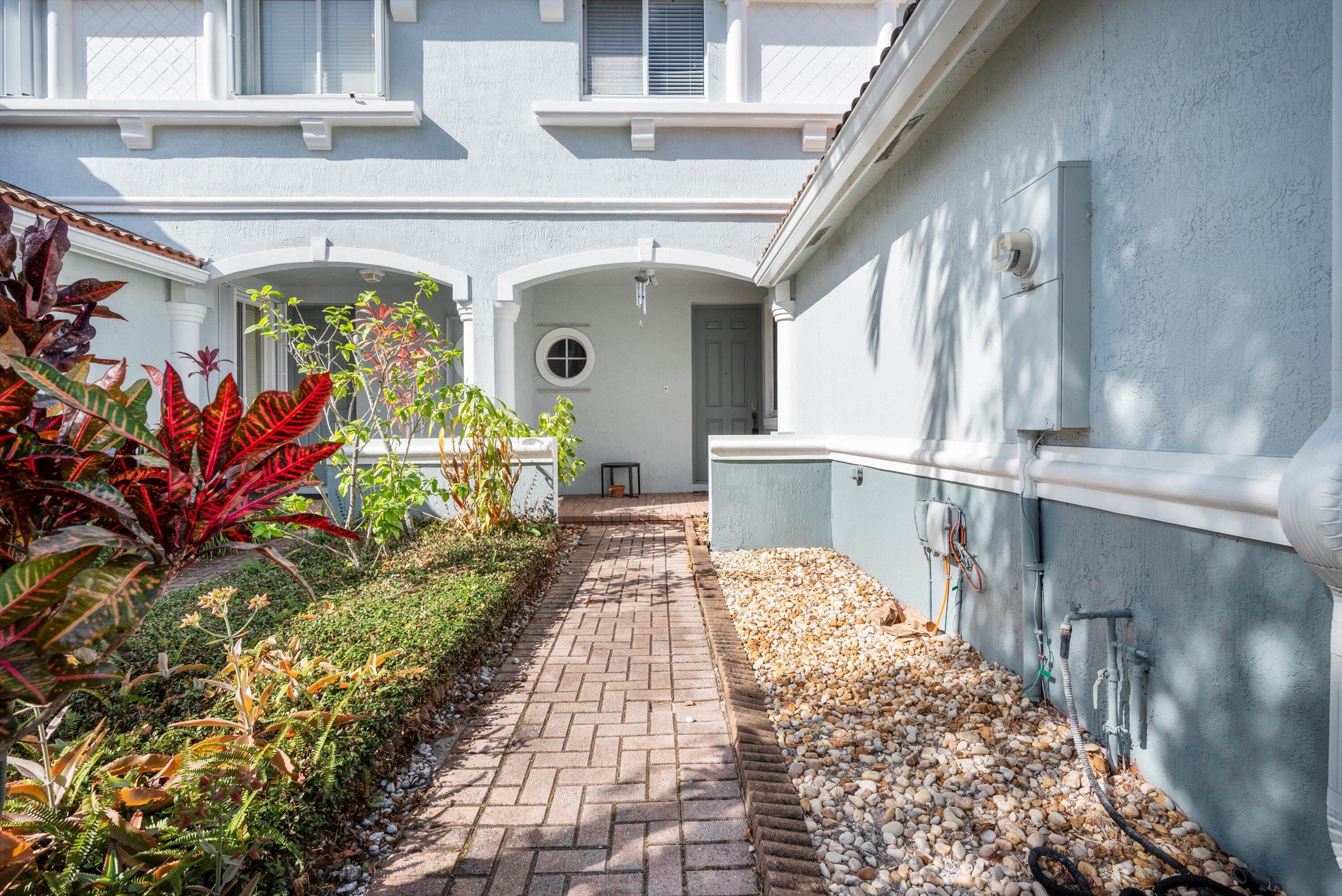 a view of entryway with flower pots