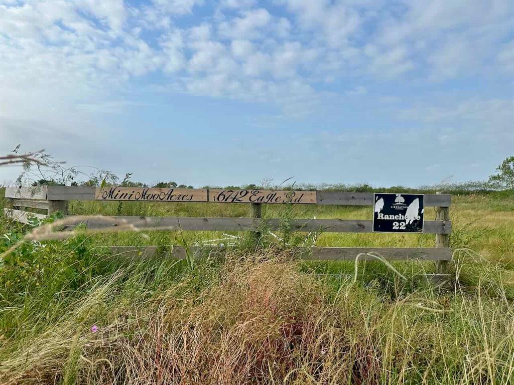 a view of a lake with a yard