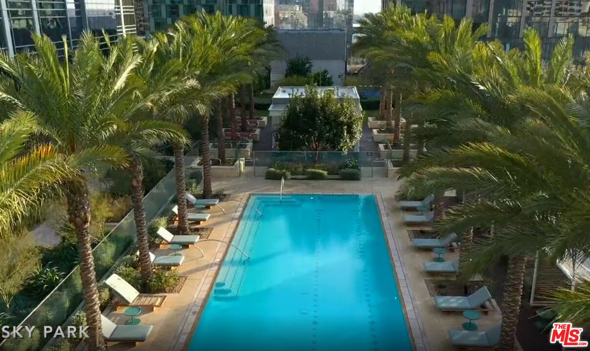 a view of a swimming pool with a patio