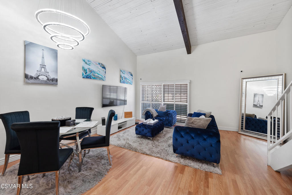 a living room with furniture rug and window