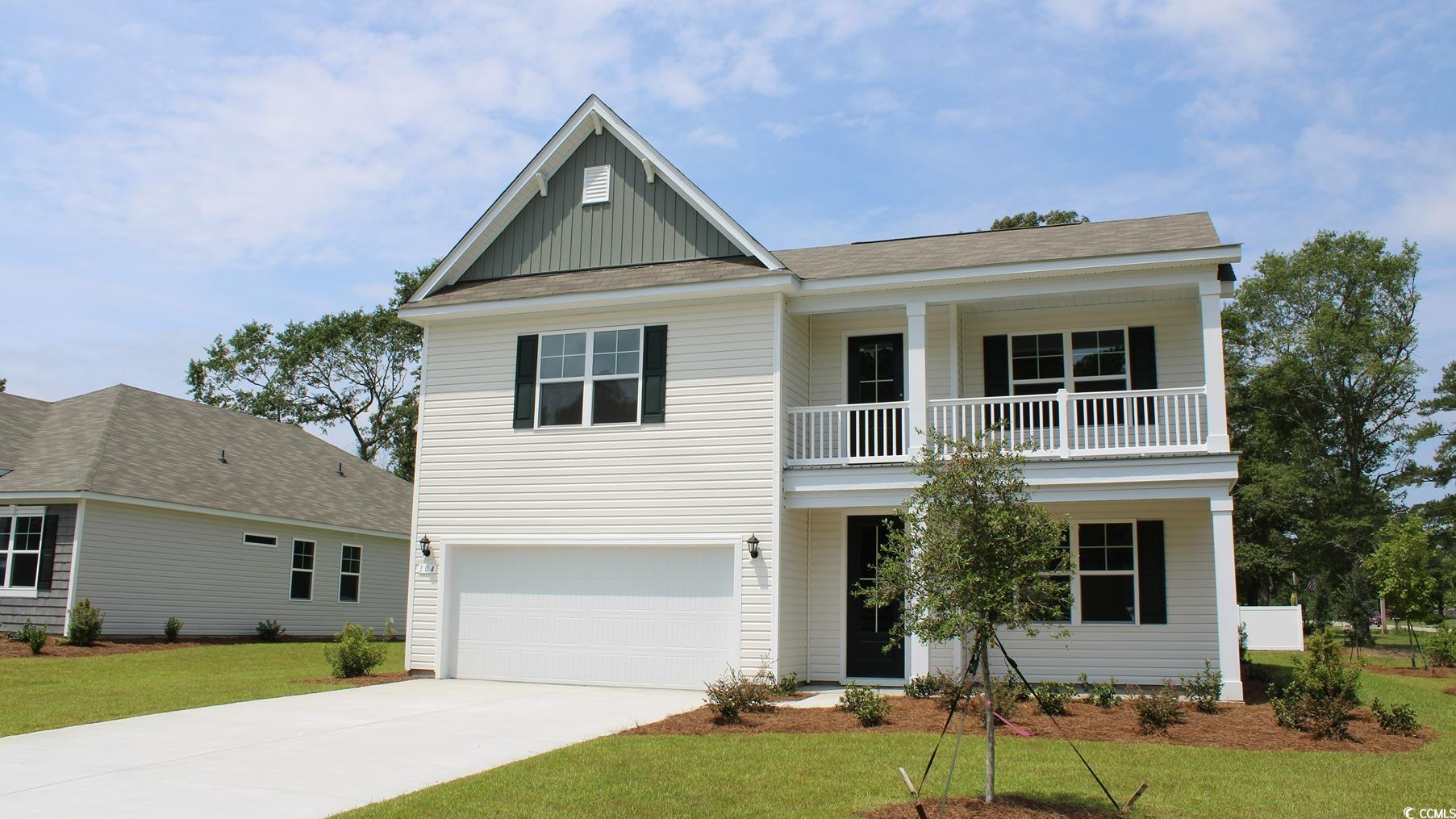 View of front of property featuring a front yard a