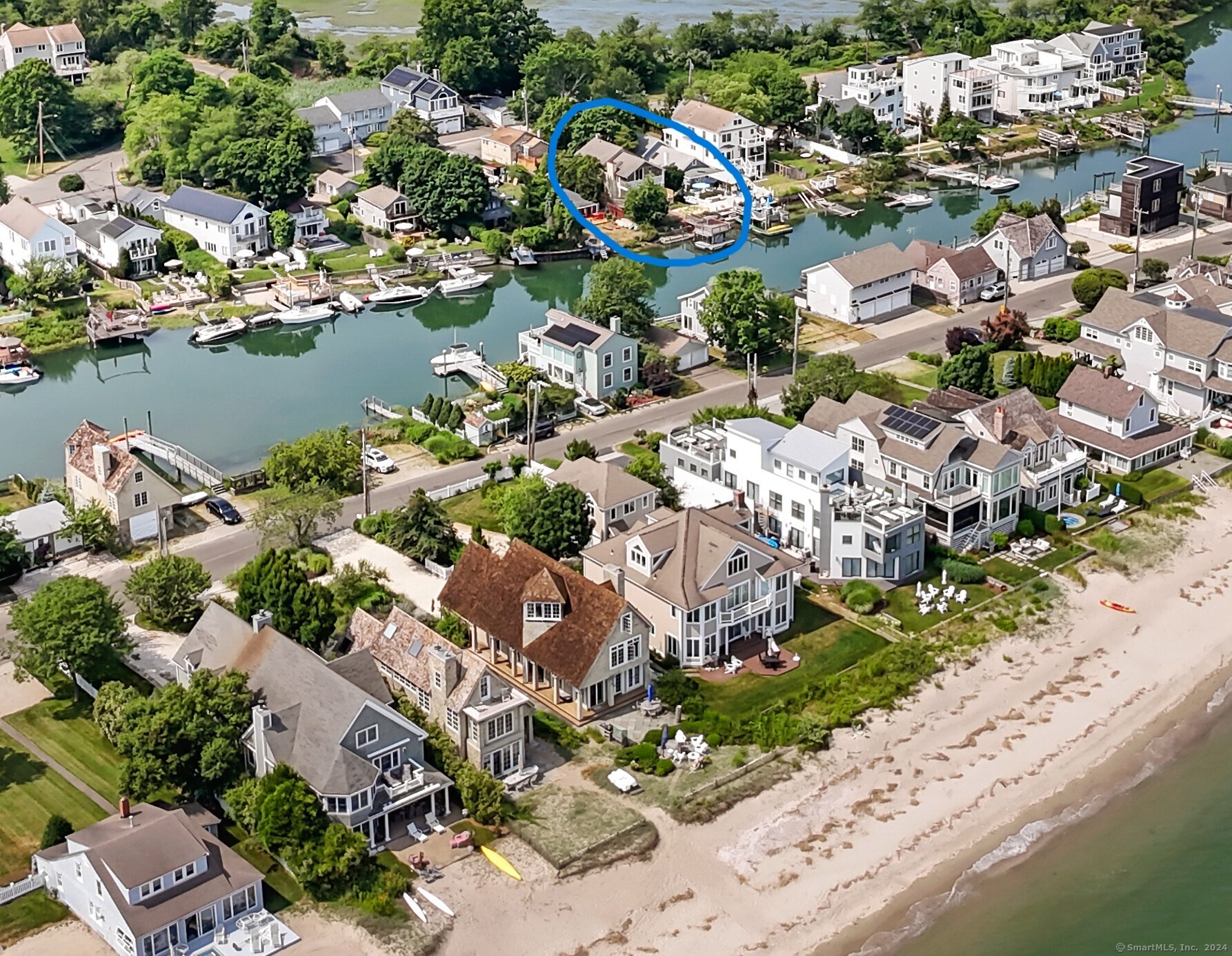 an aerial view of city lake and trees all around