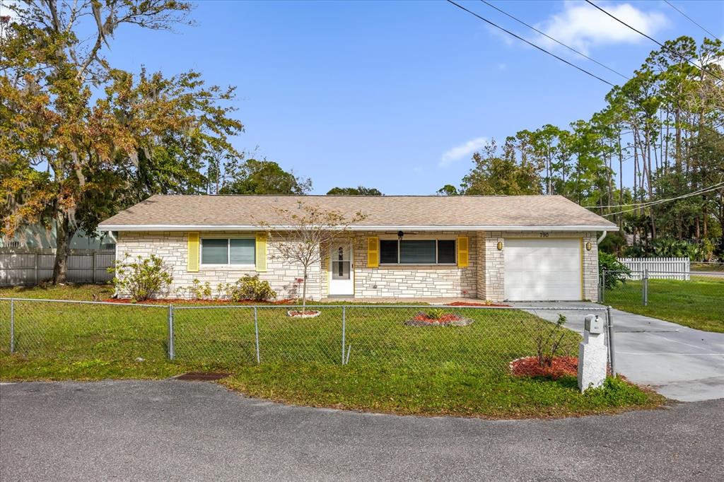 front view of a house with a yard