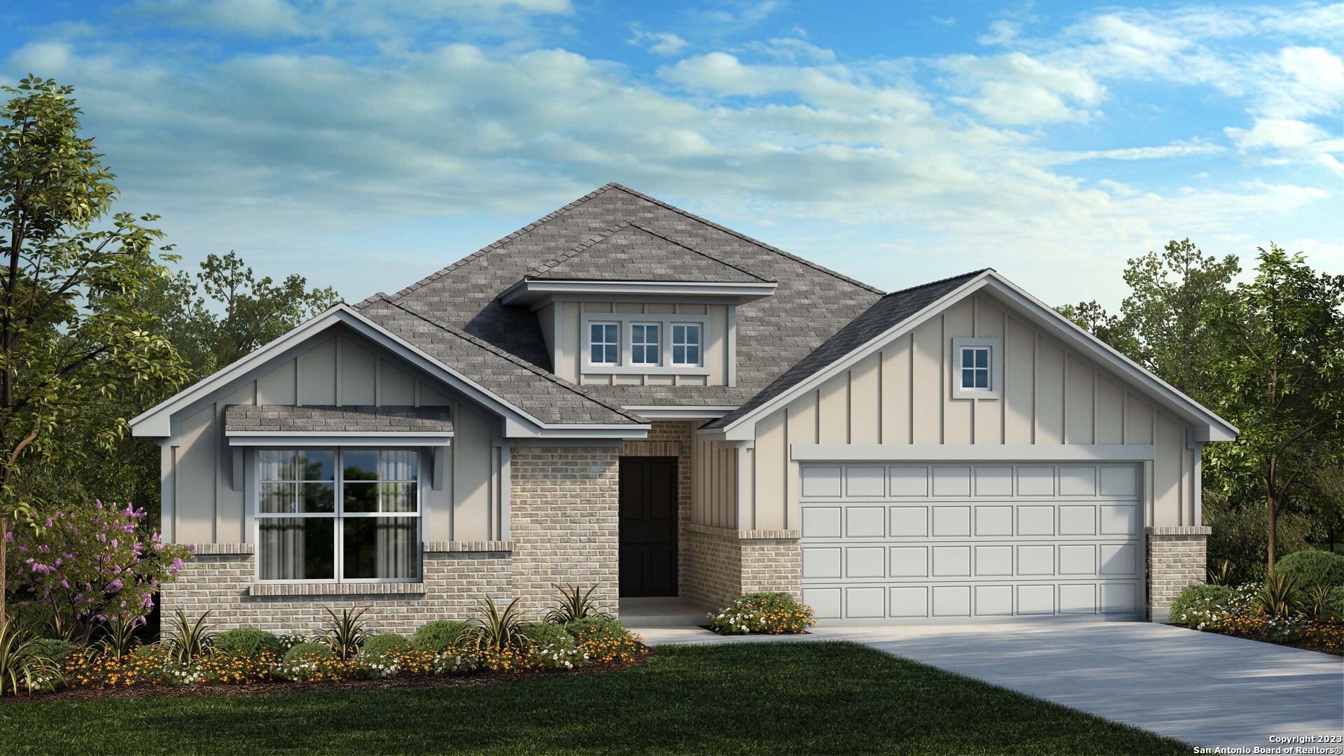 a front view of a house with a yard and garage