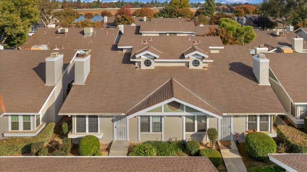 an aerial view of residential houses with street