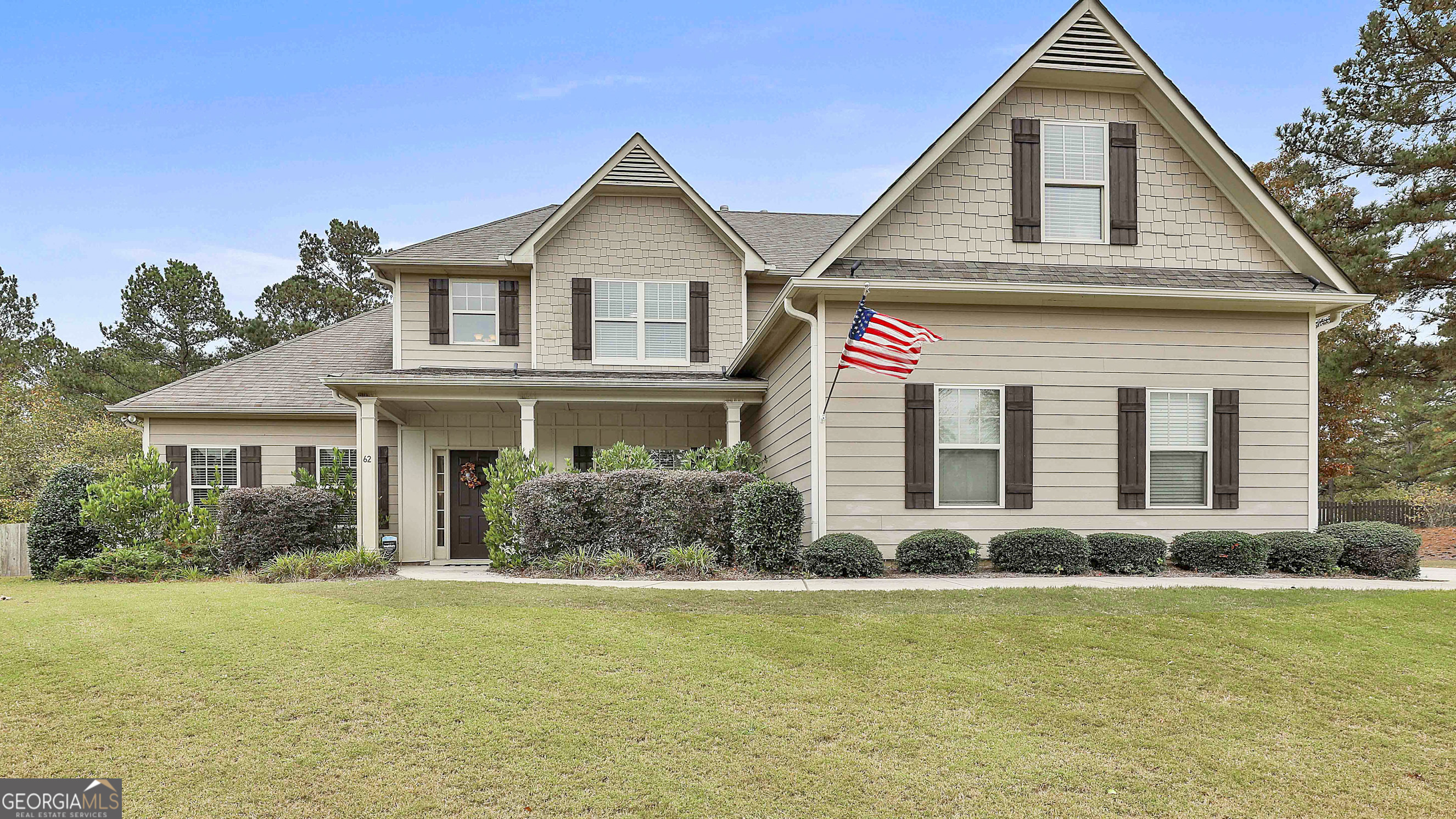 a front view of a house with a yard