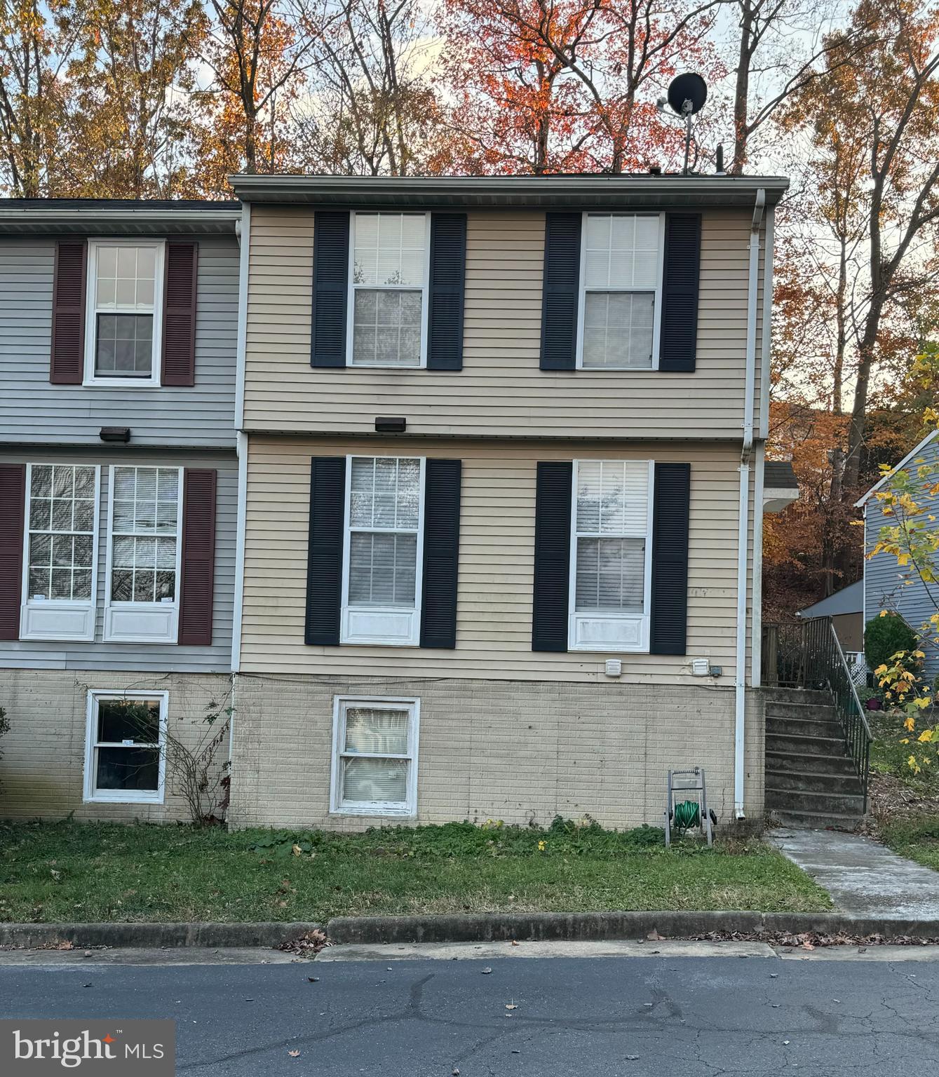 a view of a brick house with many windows