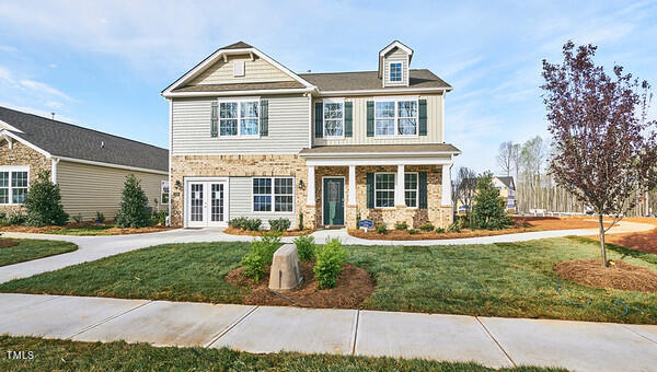 front view of a house with a yard