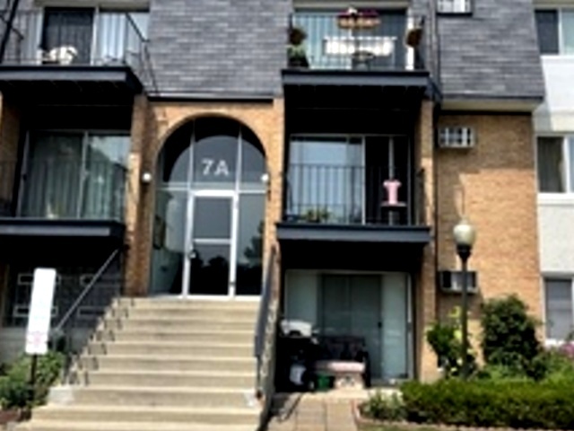 a front view of a house with a balcony