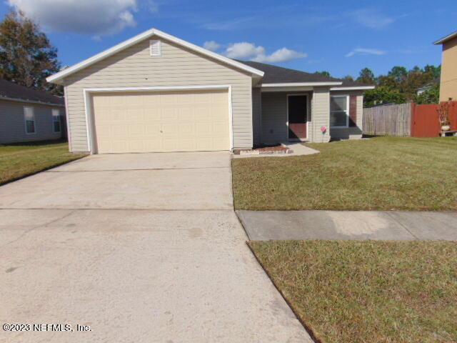 a view of house with yard