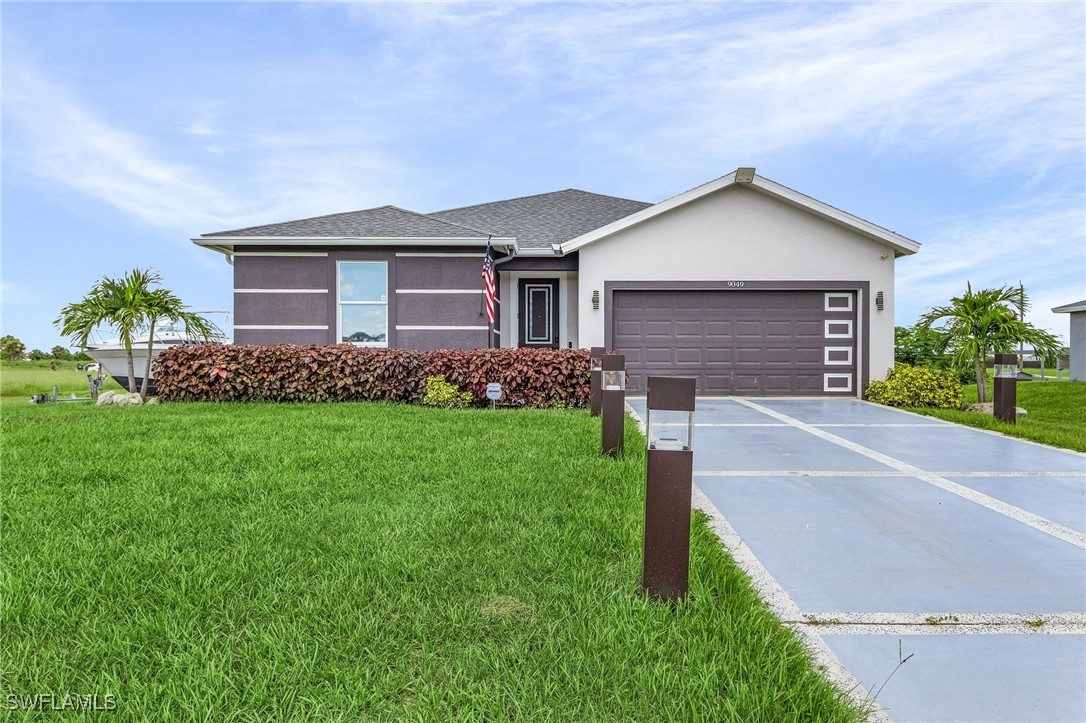 a front view of house with yard and green space