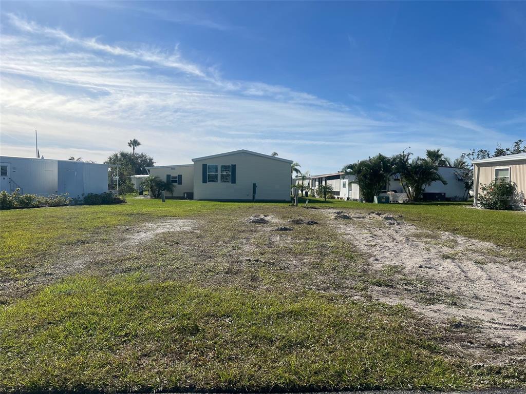 a view of a big yard with a house