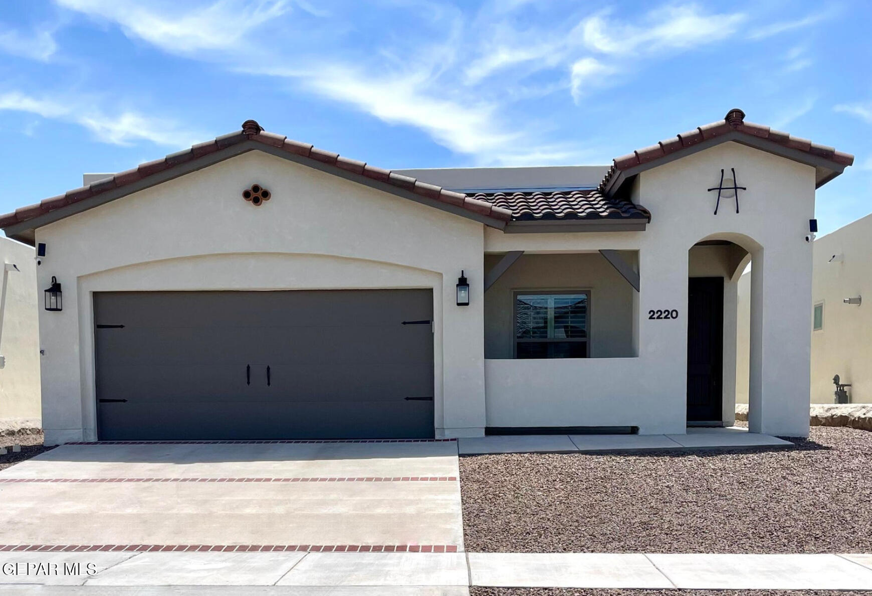 a front view of a house with a garage