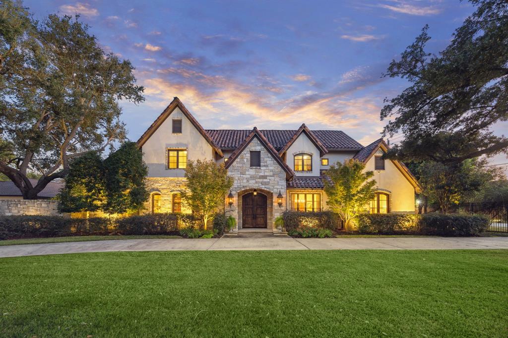 a front view of house with a garden and entertaining space