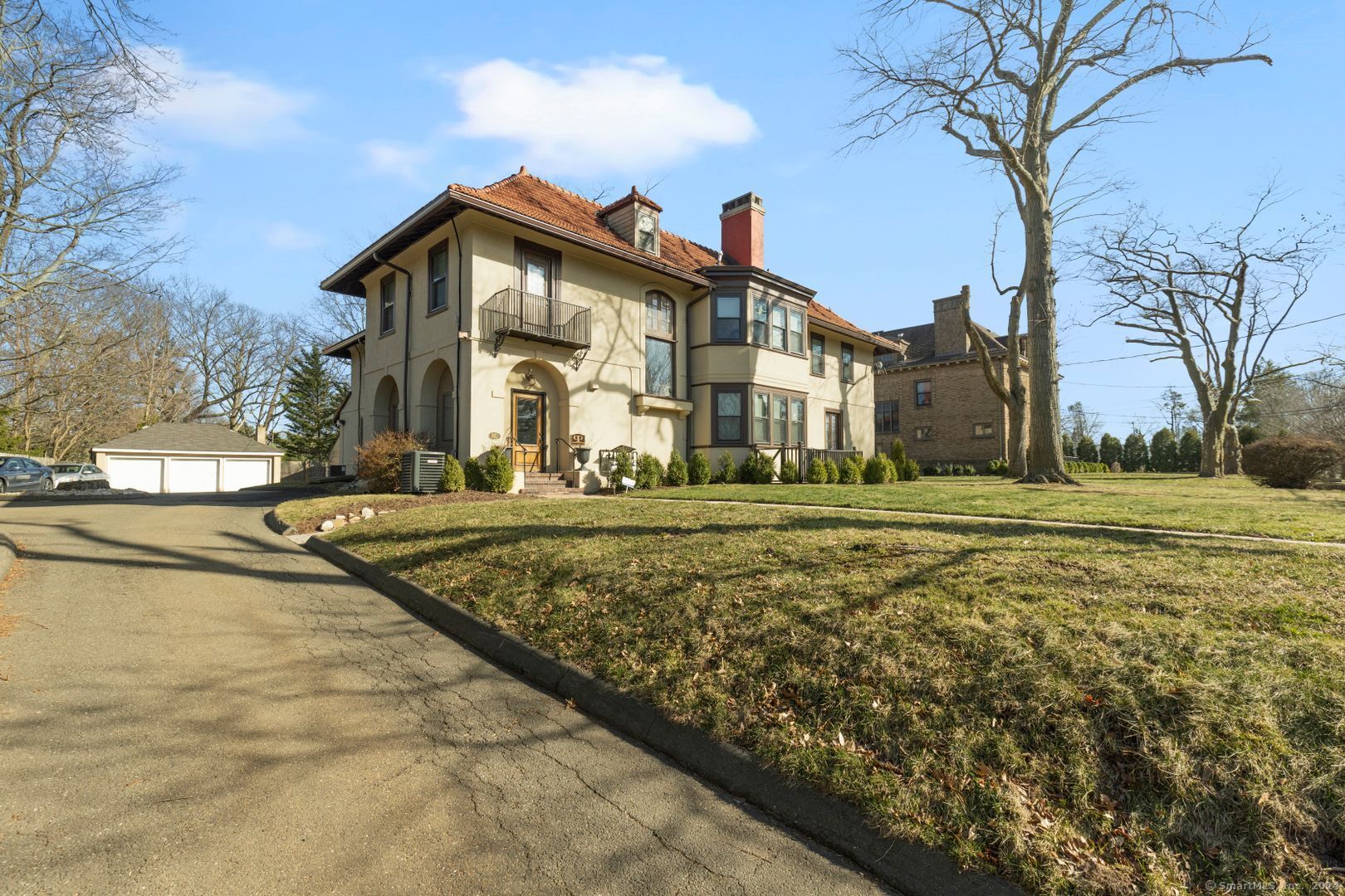 a front view of a house with a yard