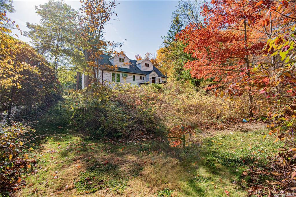 a view of a house with a tree