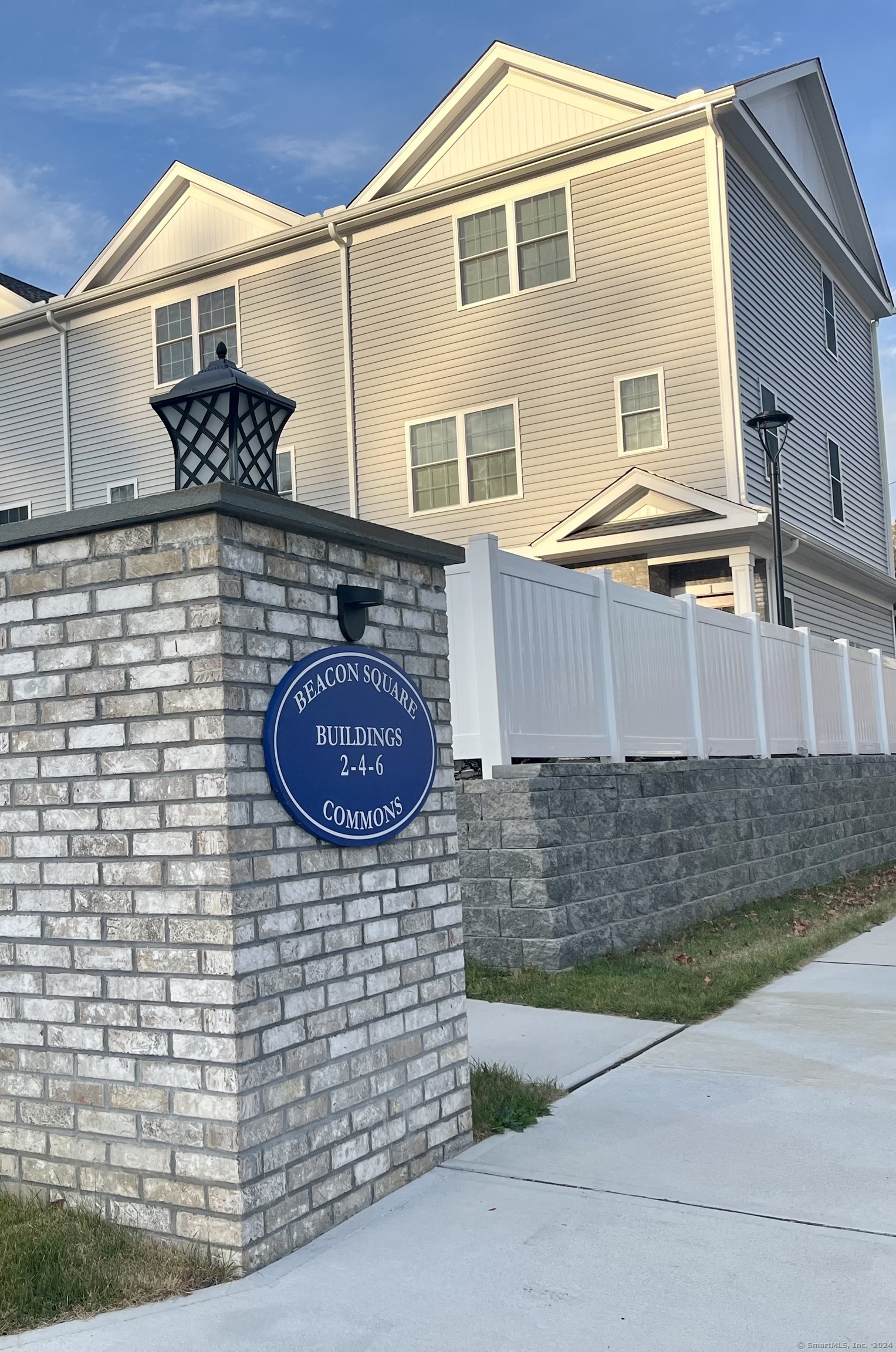 a brick building with a sink and a yard