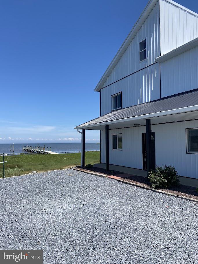 a view of a house with wooden fence