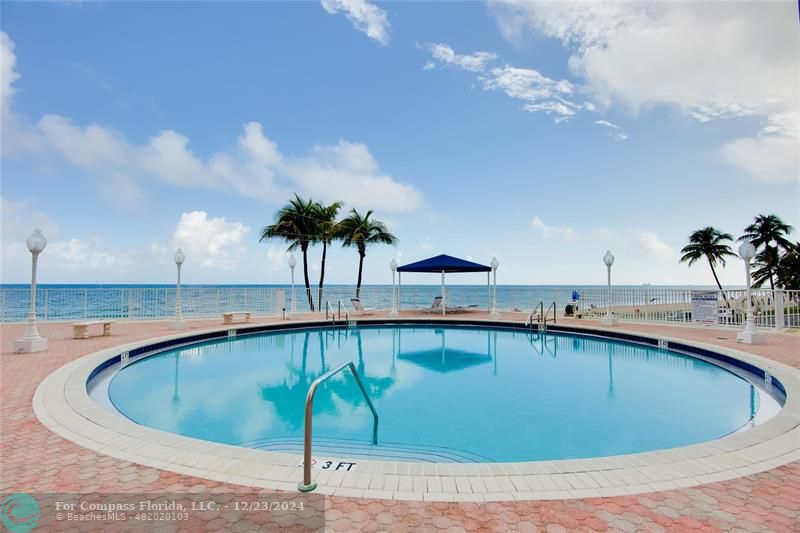 a view of outdoor space and swimming pool