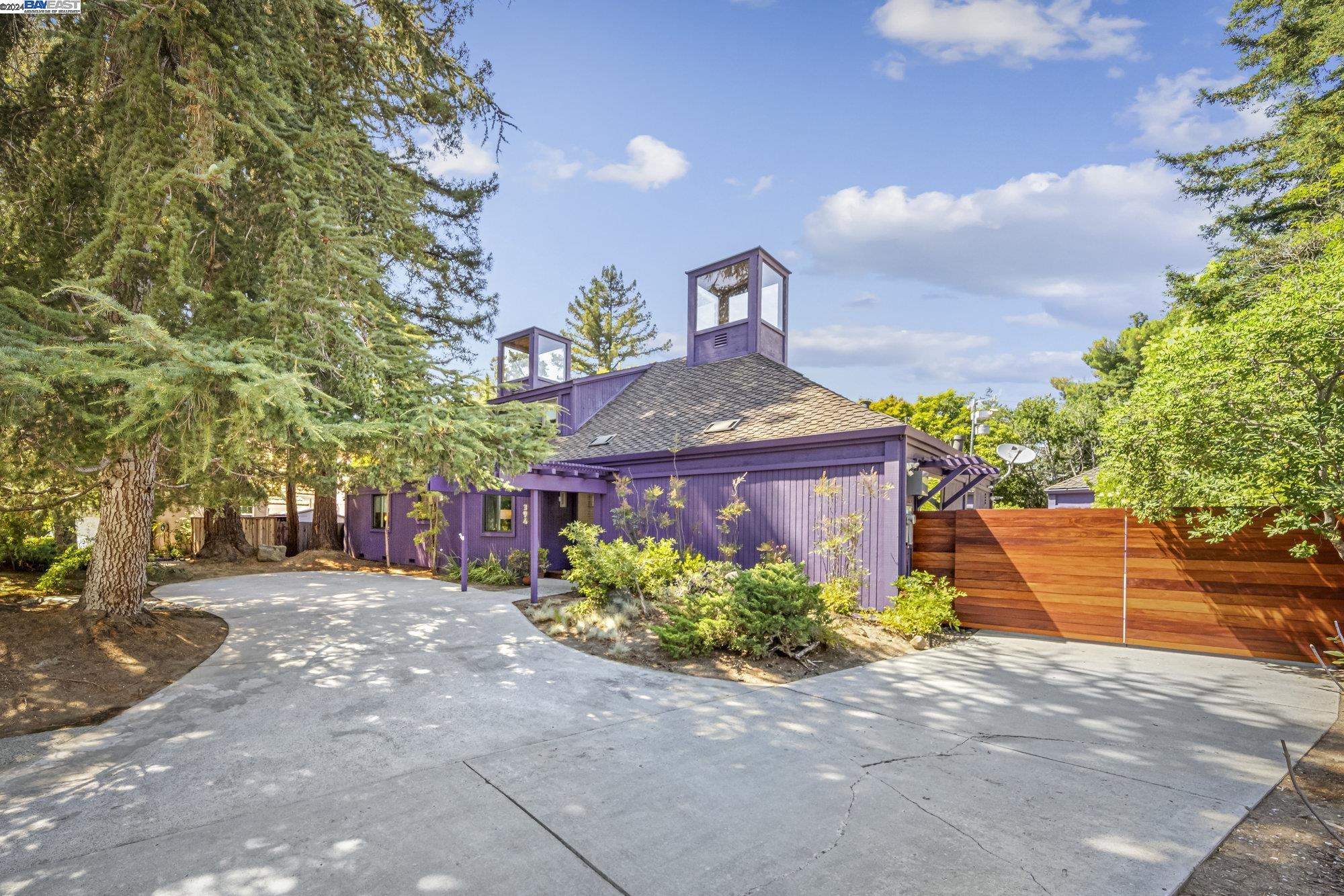 a front view of a house with a yard and a garage