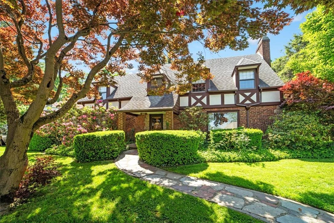 English style home featuring a front yard