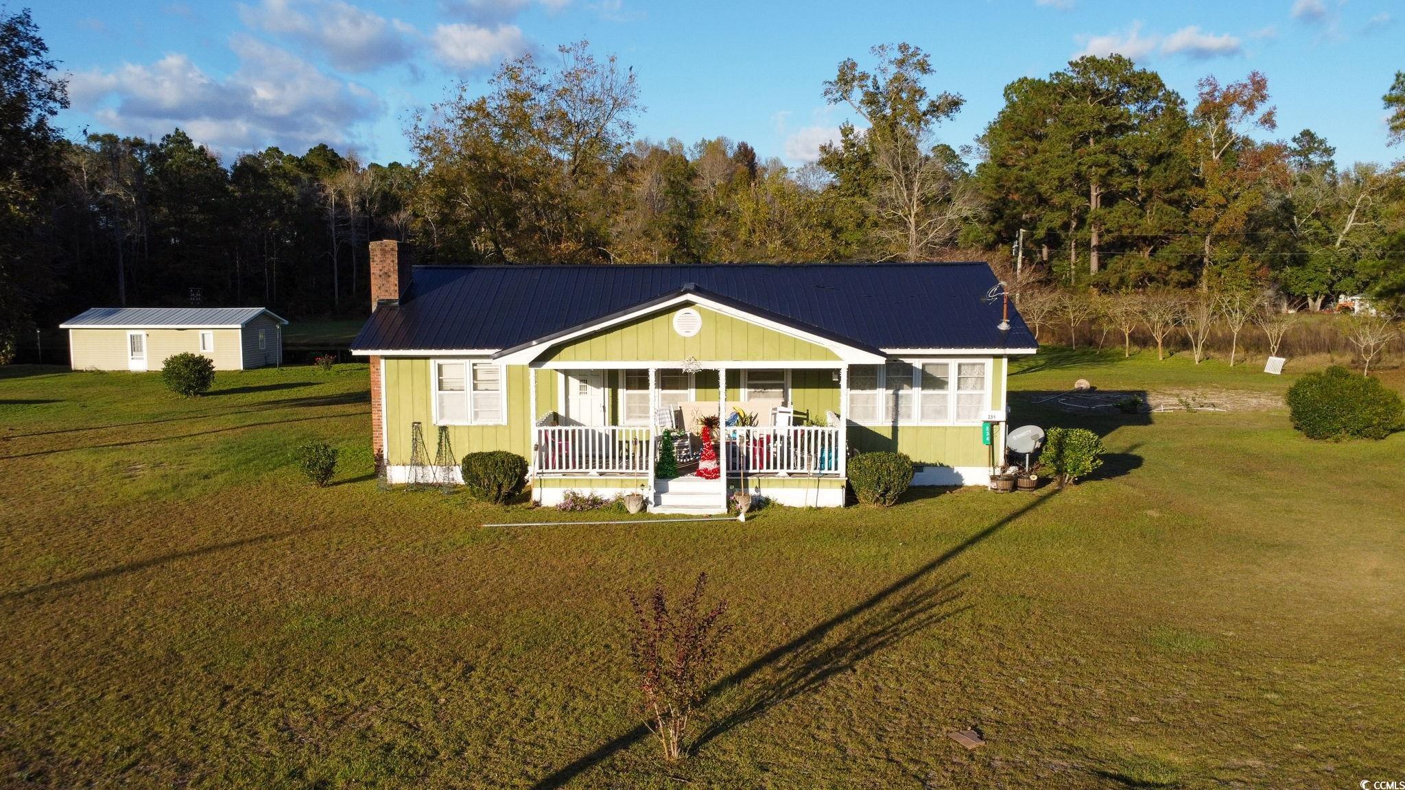 View of front of house featuring a porch and a fro