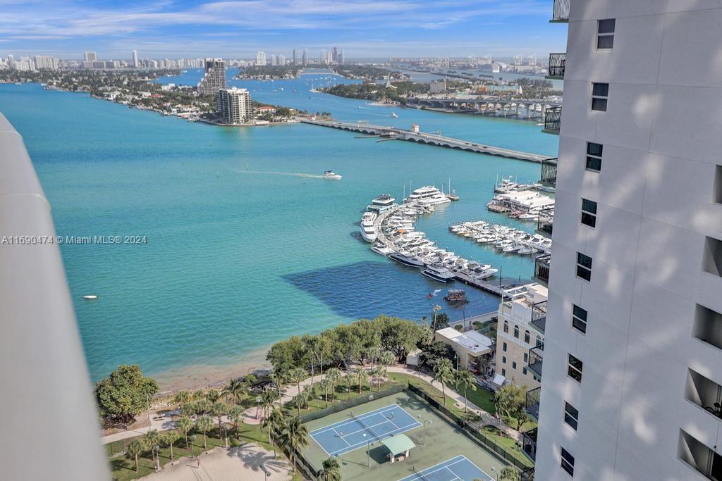 an aerial view of a house with a lake view