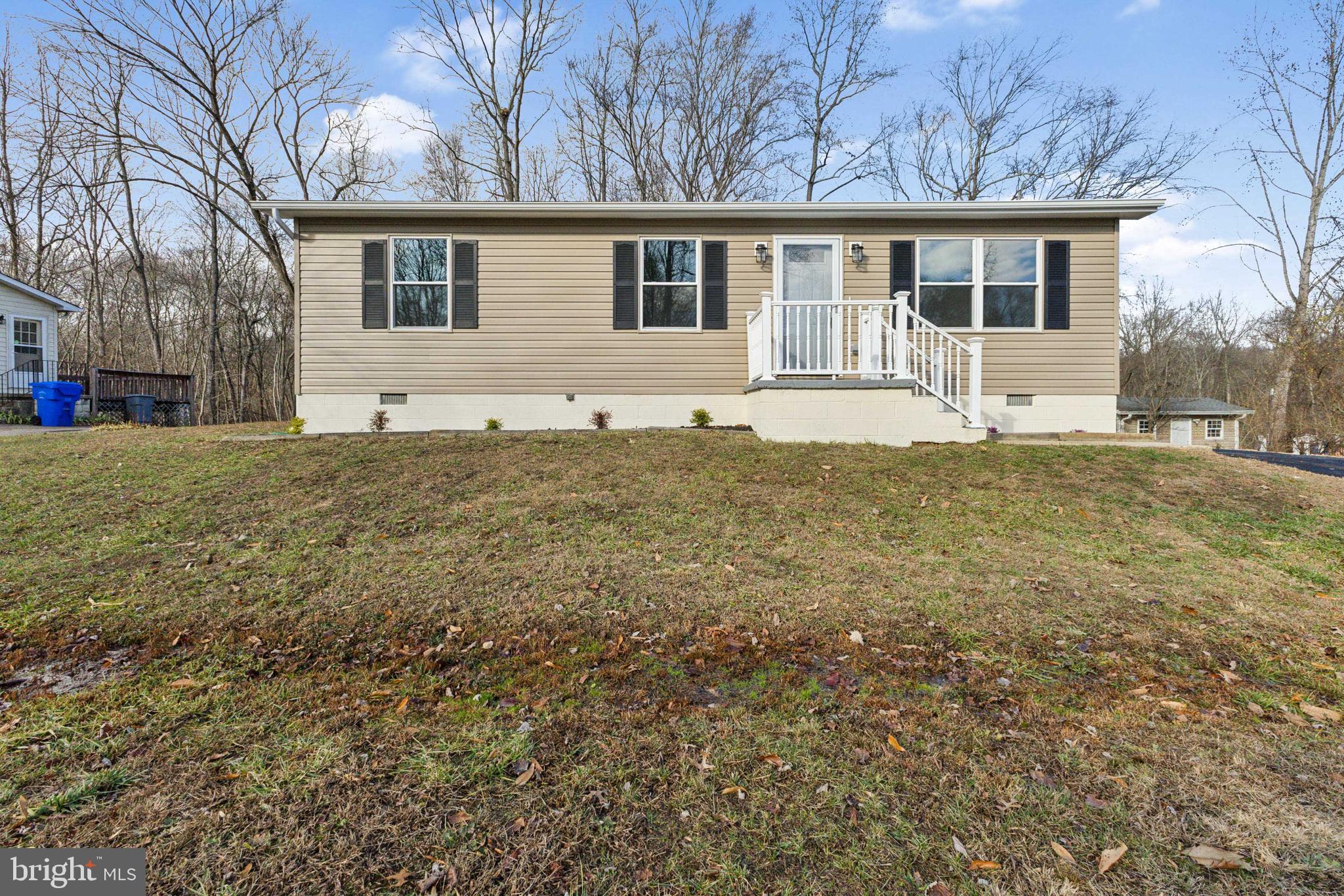 front view of a house with a yard