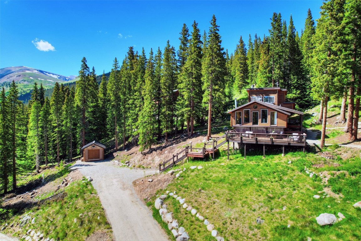 a house with trees in the background