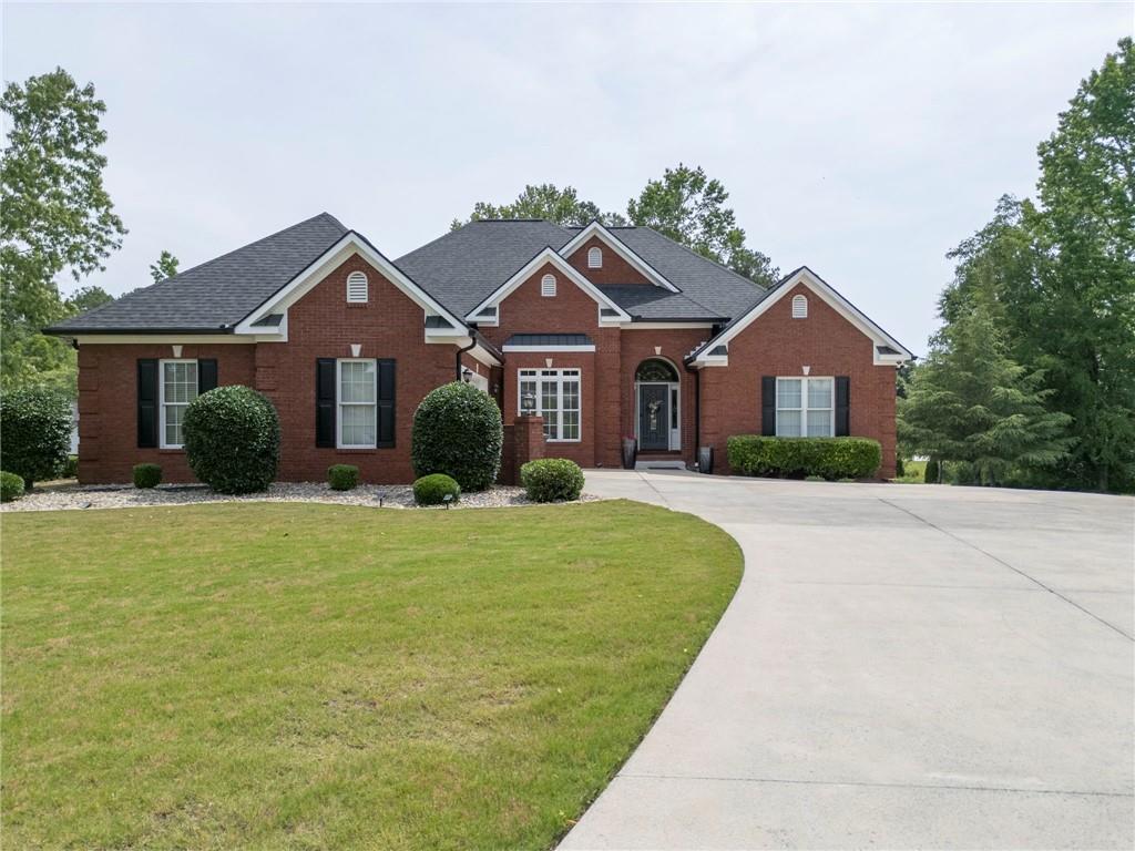 a front view of a house with a yard