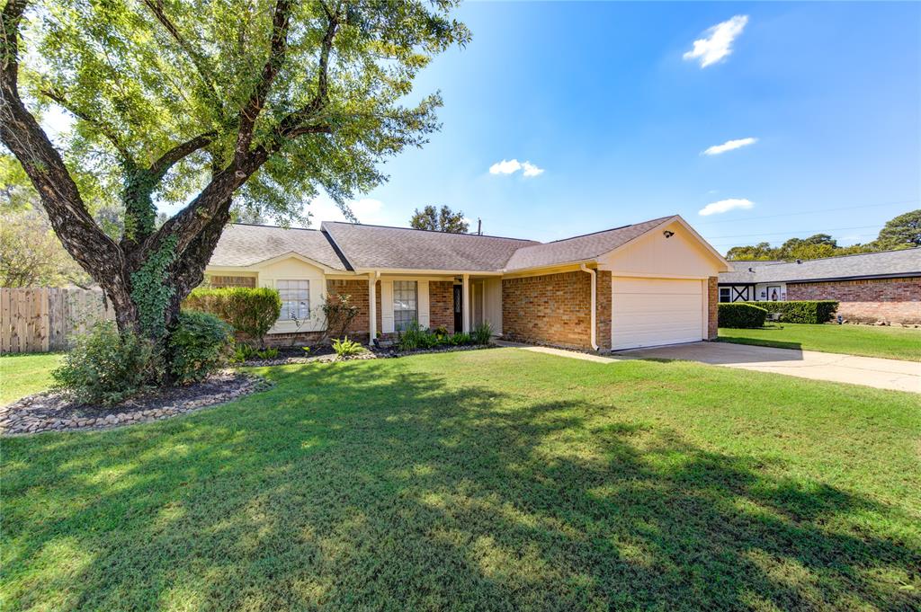 Charming Home with Inviting Curb Appeal and Mature Tree