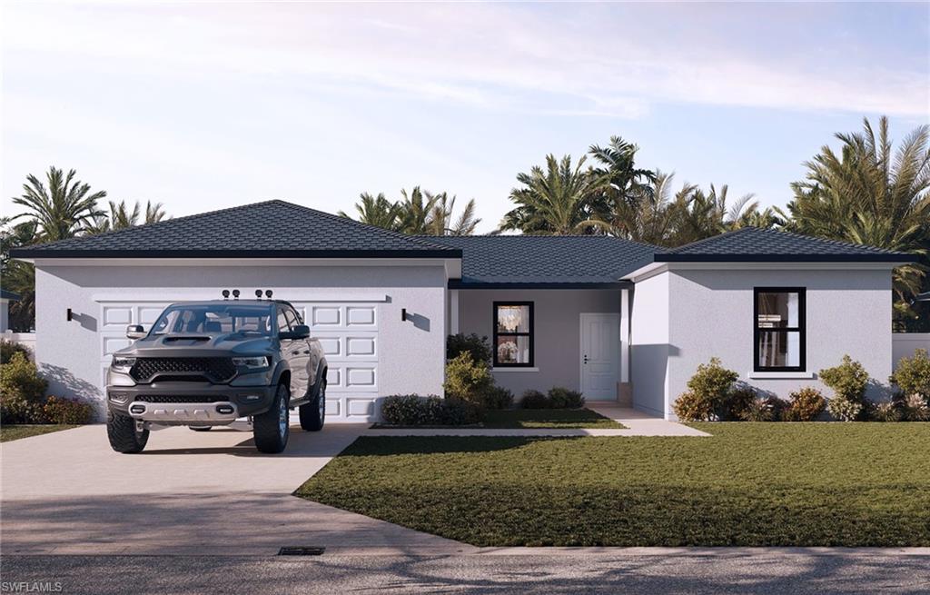 Single story home with a garage and a front yard