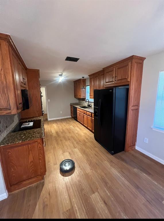 a view of kitchen with wooden floor