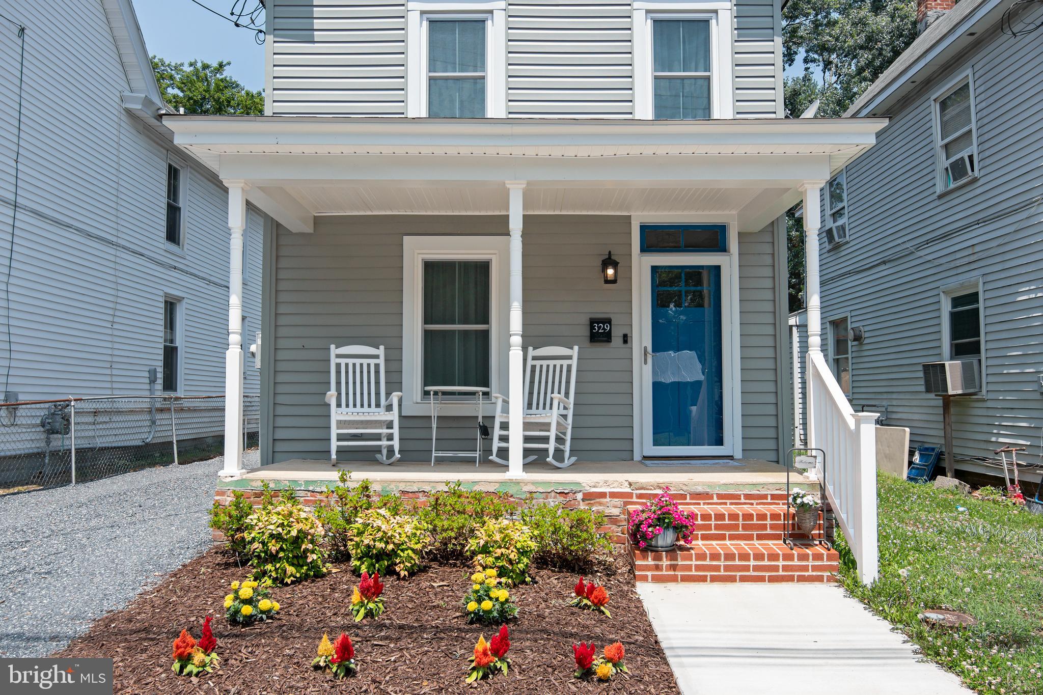 a front view of house with an outdoor space