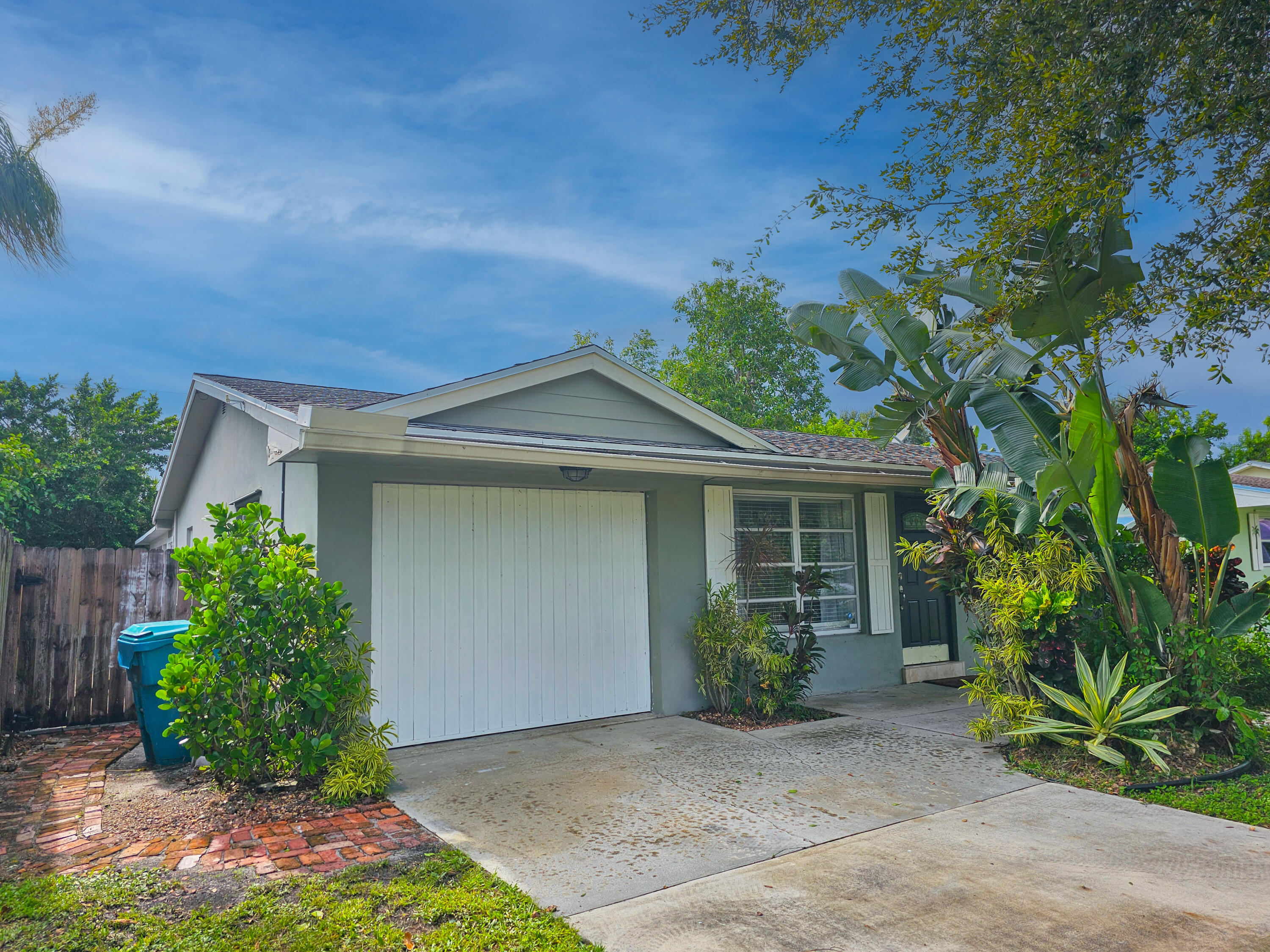 front view of a house with a garden