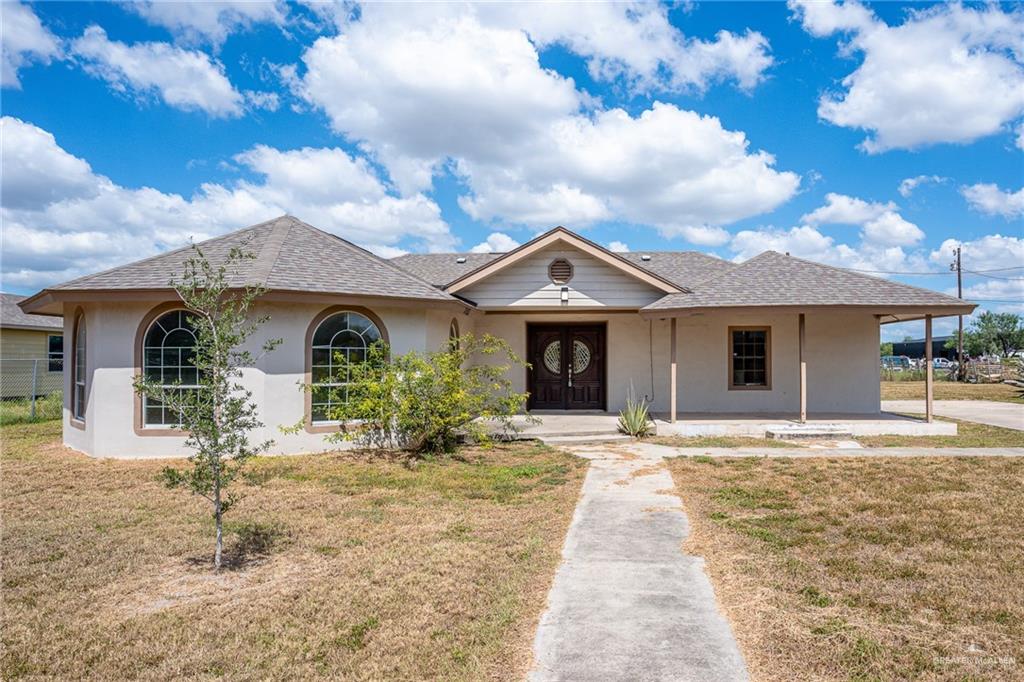 front view of a house with a yard