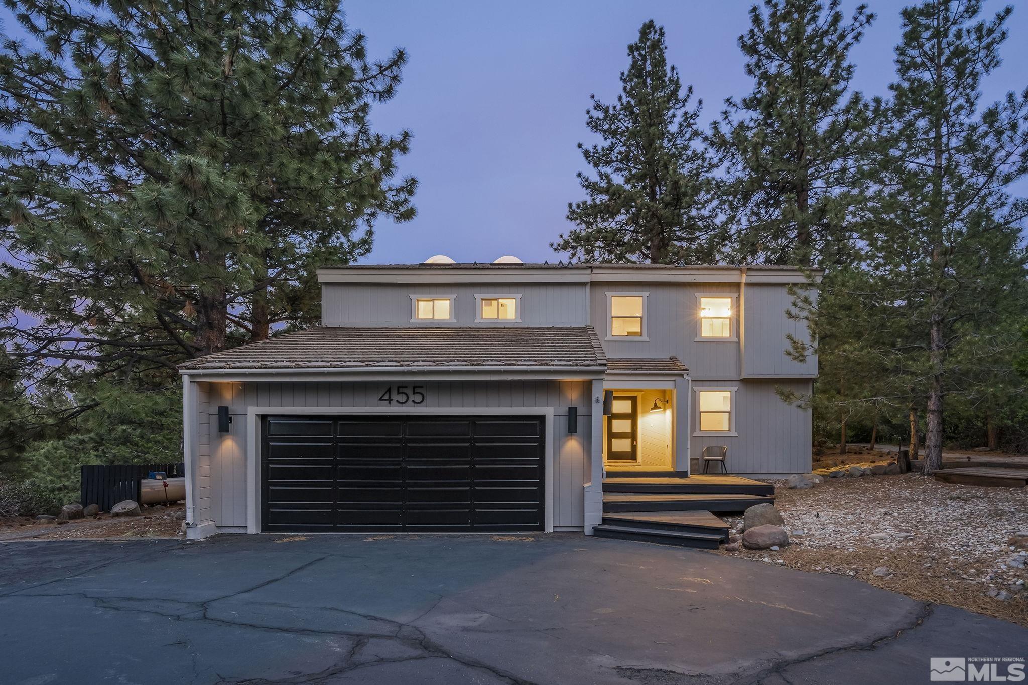 a front view of a house with a garage