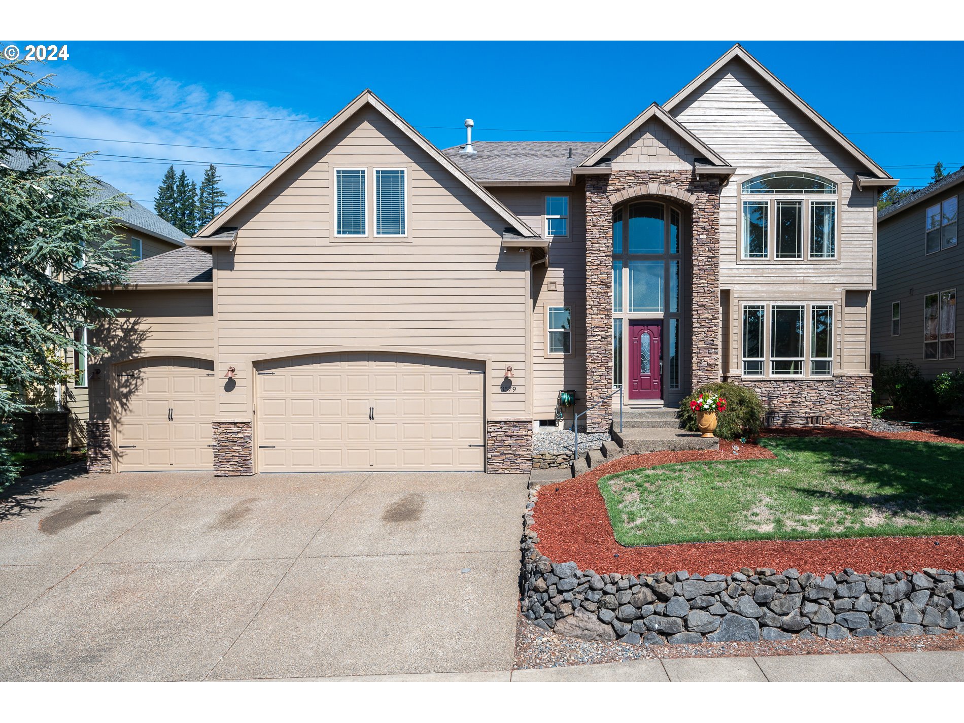 a view of a yard in front view of a house