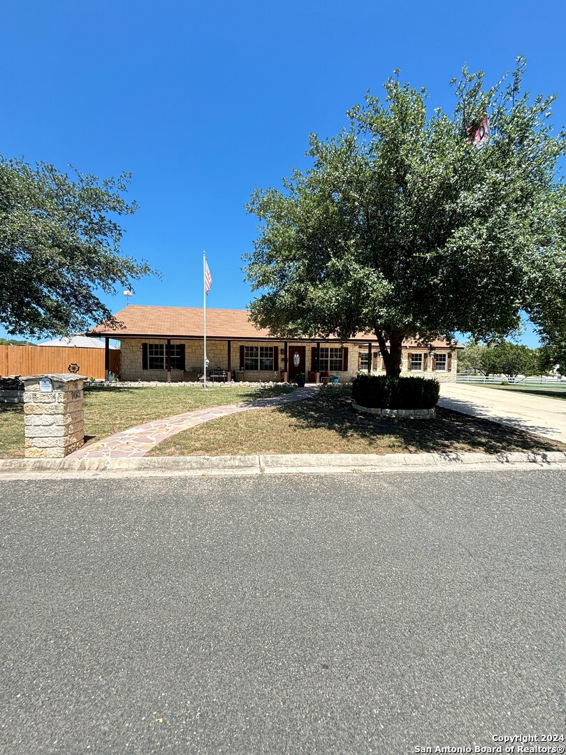 a view of a house with a yard