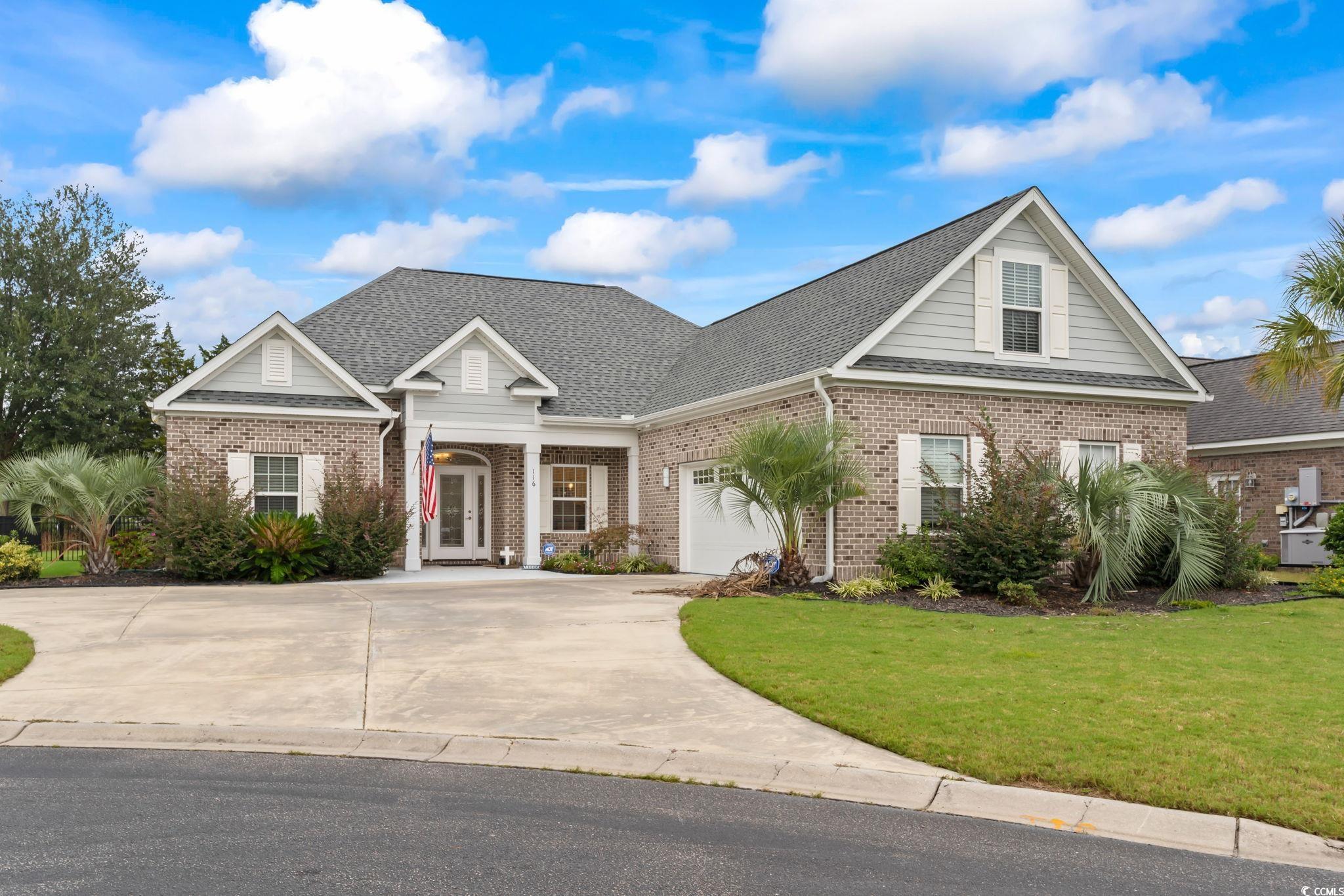 View of front of house featuring a garage and a fr