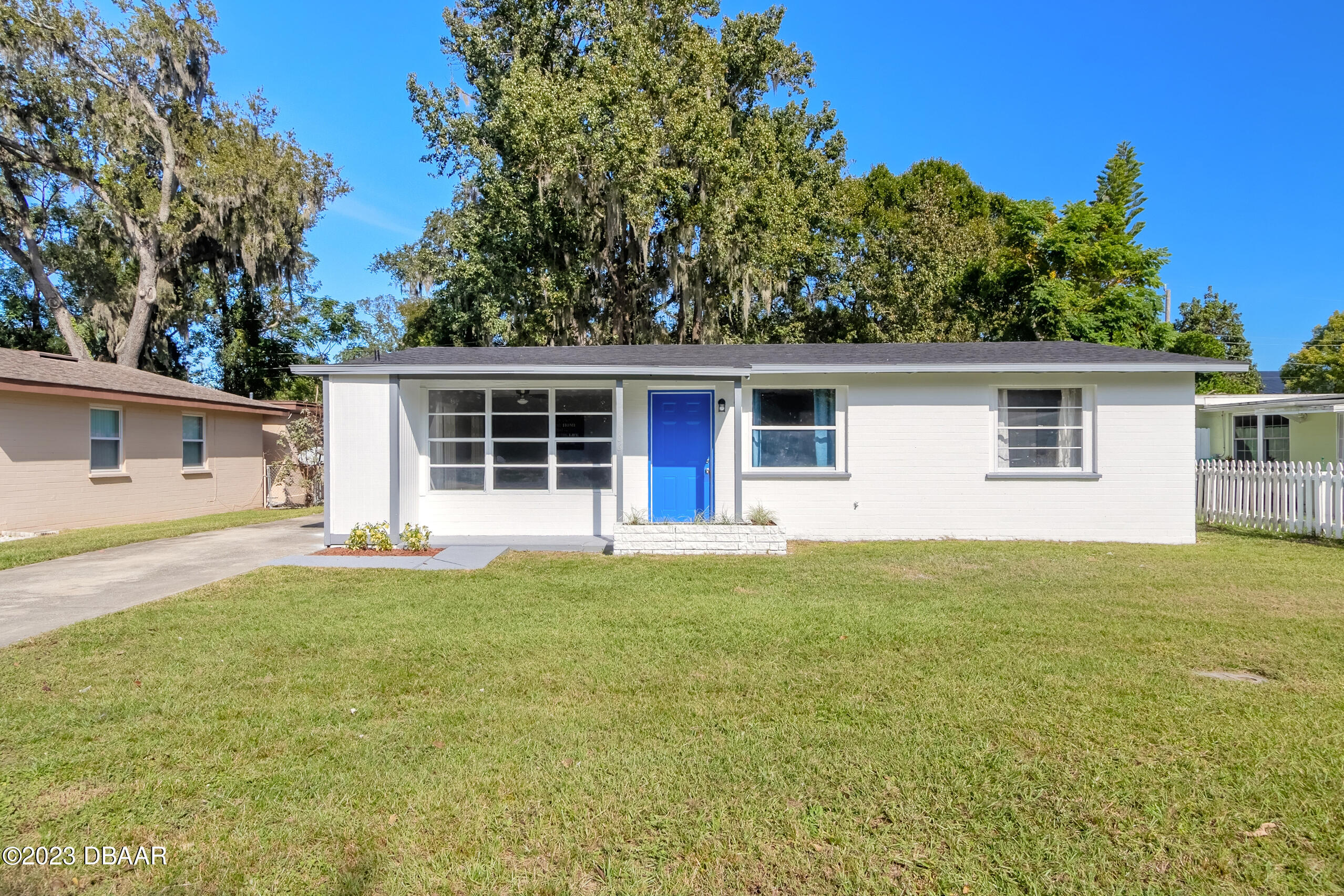 front view of a house with a yard