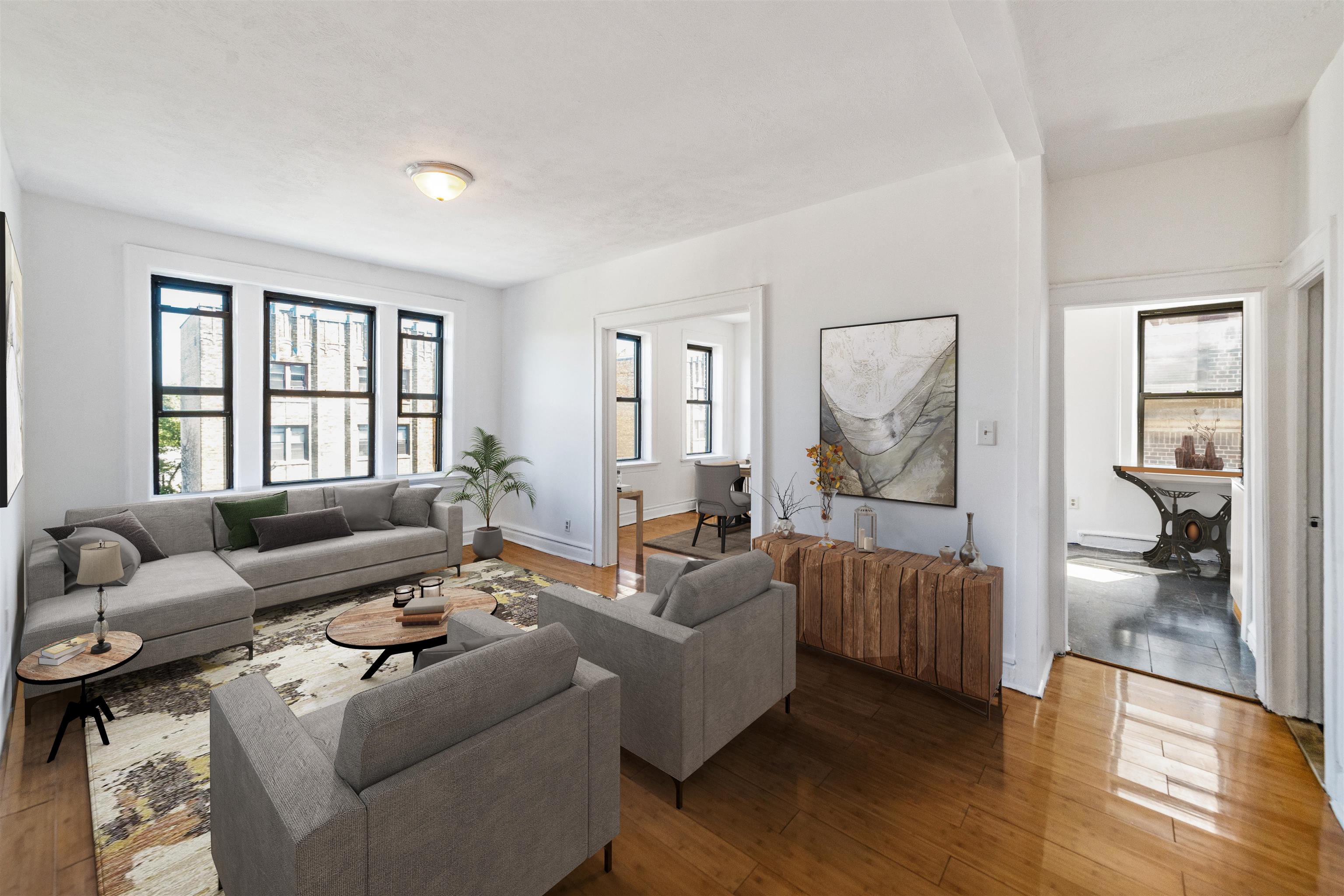 a living room with furniture and a large window