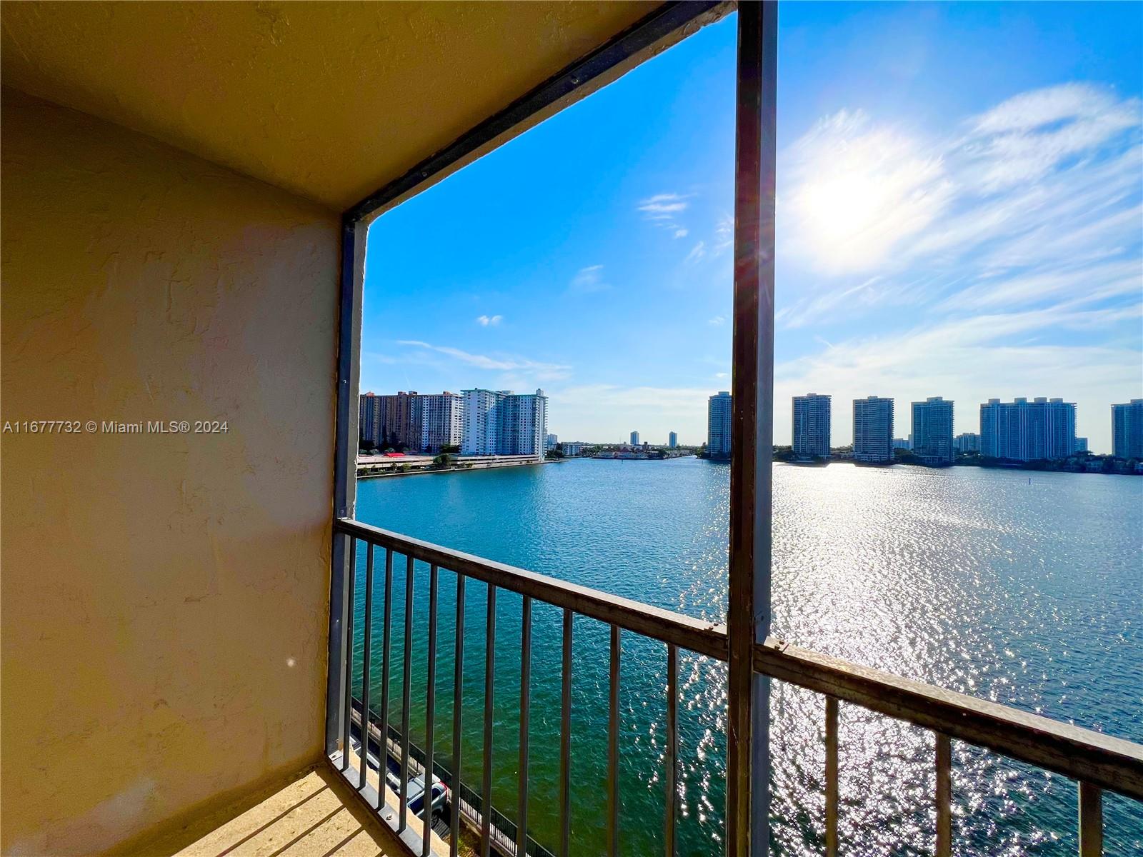 a view of balcony with a floor to ceiling window and wooden floor