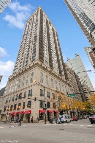 a tall building sitting on the side of a street