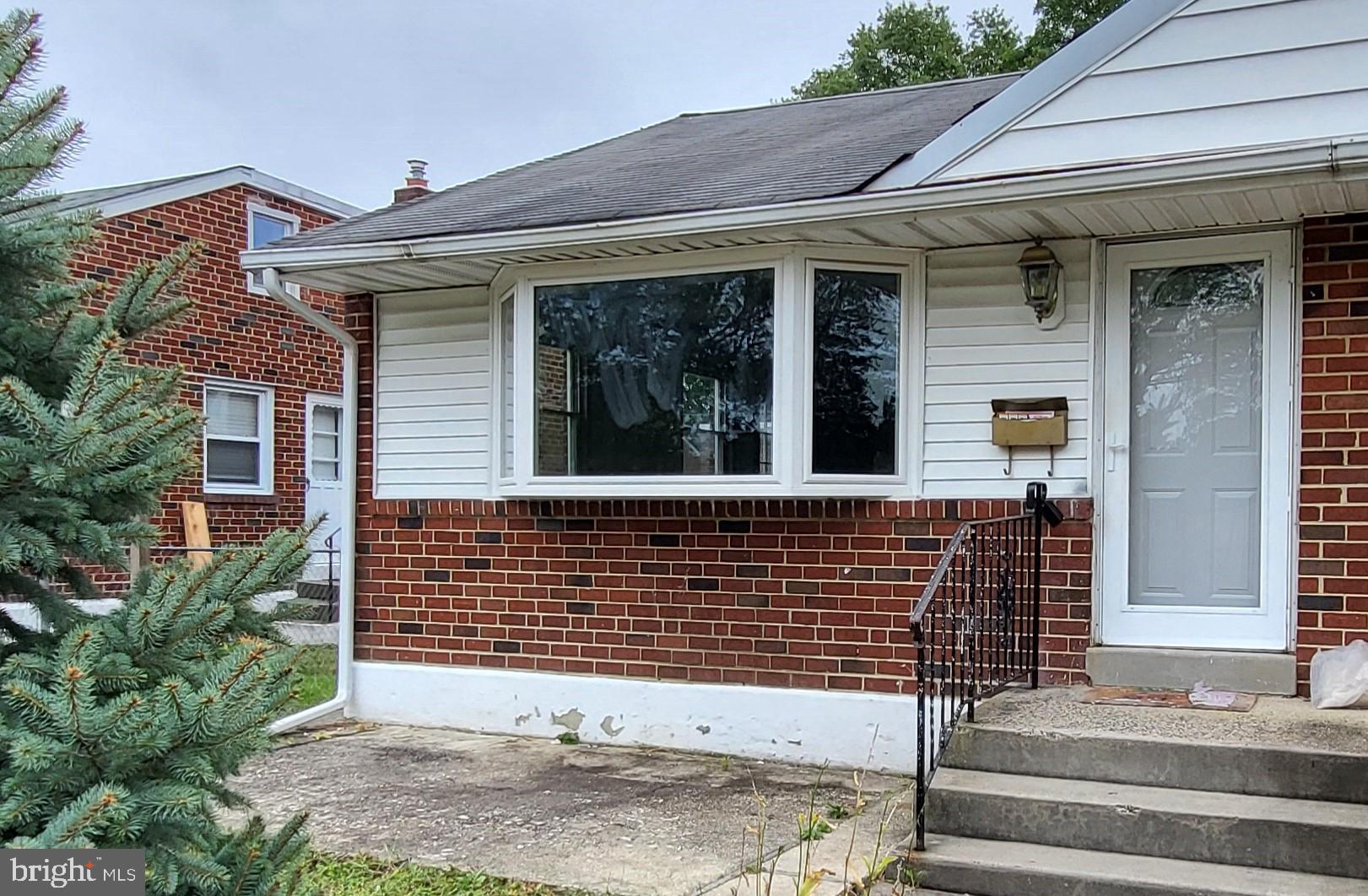 a front view of a house with garage