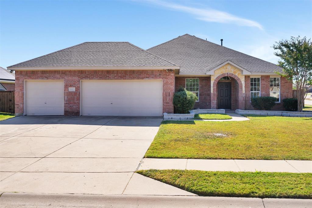 a front view of house with yard and swimming pool