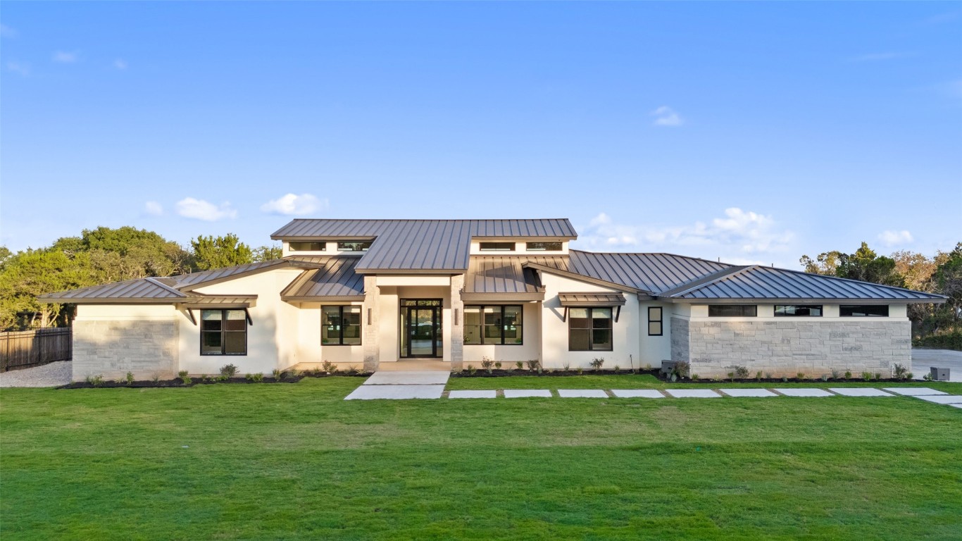 front view of a house with a yard