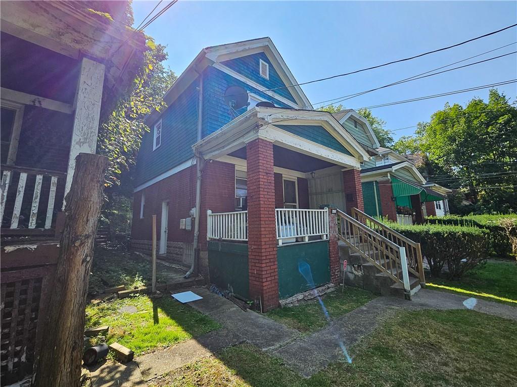 front view of a house with a yard