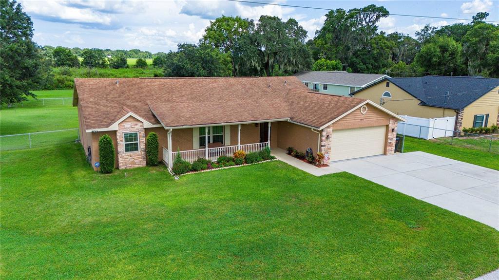 a aerial view of a house with a yard