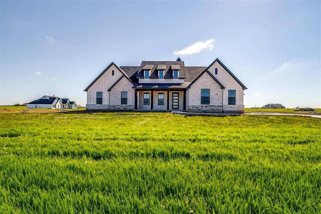 a view of a house with a big yard